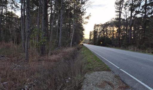 View of asphalt street featuring view of scattered
