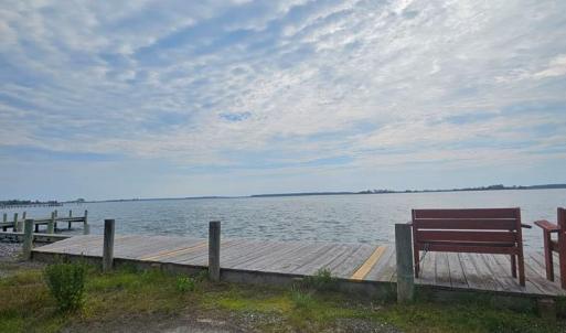 Sitting area on the Oyster Bay, Come sit or crab on the bench provided in the community.