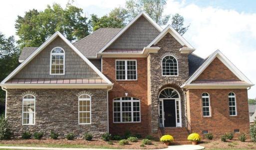This is an example of the House Plan that is approved for affluent Crown Ridge Estates. As of 2024 the value of the home being built and the one starting construction soon is $1,000,000 to $1,300,000. Purchasers should anticipate to spend 1M turn key.