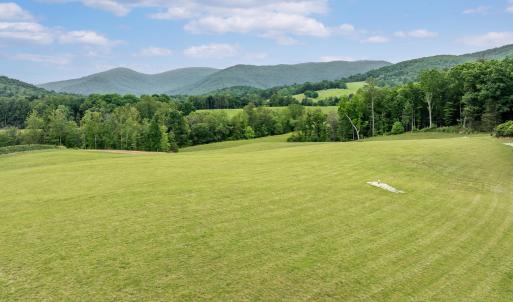 This expansive view was captured while standing on the ground! That is one of four wells on the property. One for home use, one for gardening and two for a geothermal heat system.