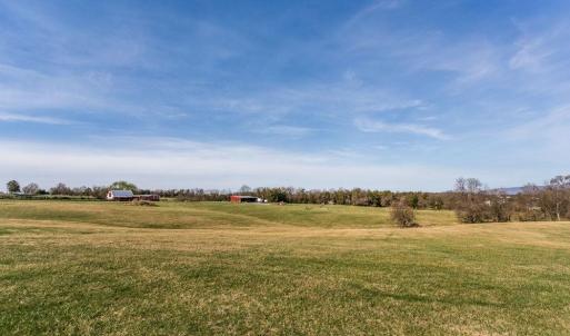 looking back to pole shed on west side and new building on SE side of property.