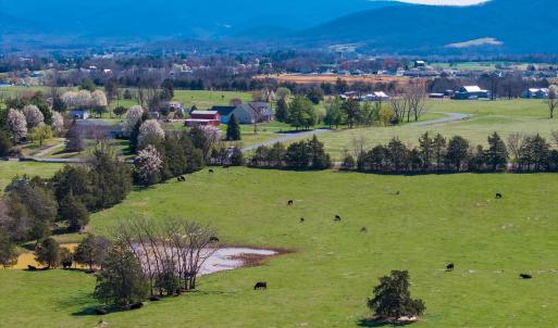In view is the grazing pasture with pond looking east.