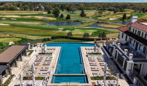 Infinity pool & cabanas, view of the Full Cry links-style championship golf course designed by Pete Dye.