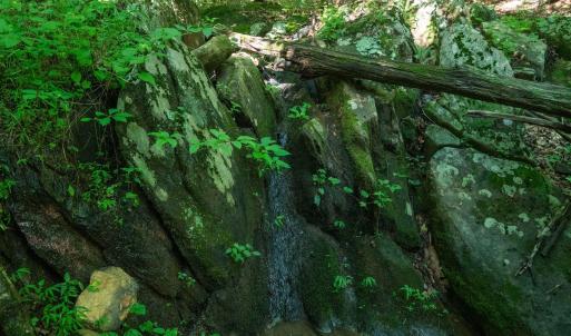 Small waterfall over natural rock