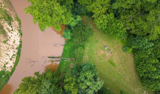 Aerial view of creekside clearing