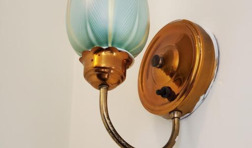 art glass sconce in stairhall