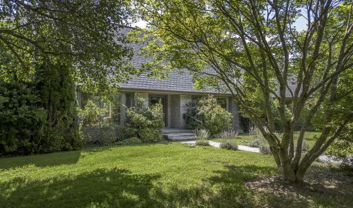 Home viewed from shaded driveway