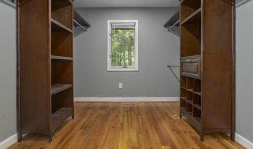 Primary Suite walk-in closet 1