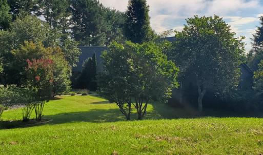 View of home from vacant lot sideyard