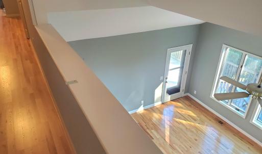 new flooring upper level Hall and LR