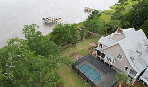 side view of home and dock and water