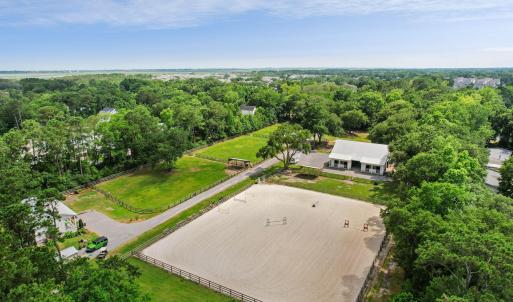 Aerial: paddocks, barn, and arena