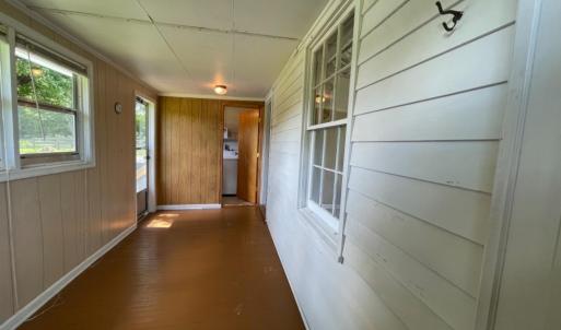 Sun porch to laundry room and rear yard.