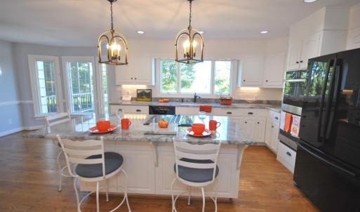 LARGE CENTER ISLAND IN KITCHEN - NEWLY UPDATED WITH GRANITE, WHITE CABINETS AND APPLIANCES