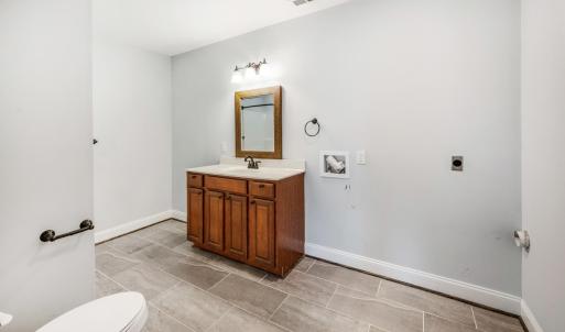 Basement bathroom with additional laundry option