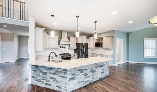 Gorgeous main-level kitchen with granite countertops, pot filler, stainless steel appliances, and more!