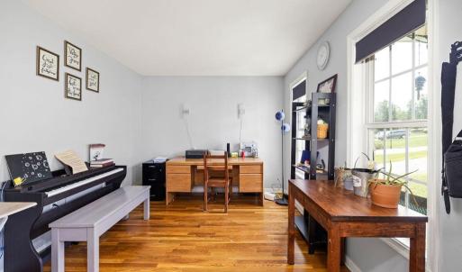 Just inside the front door is this cheery versatile room~ office? music room? sewing room? quiet den? formal living room?