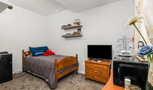 A cozy guest bedroom with mini frig, microwave and coffee machine!