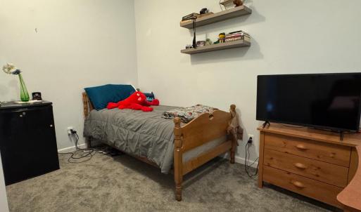 This room currently has a window but not a closet. It would be easy to add one here OR you could use the one under the stairs or in another room down the hall from here.