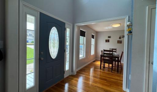 Entering the front door; the Dining Room is on the Left; the hall is straight ahead.