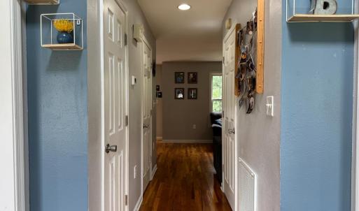 The hallway leading from the front door to the LR