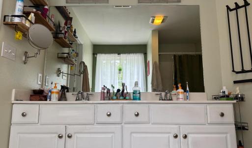 Pretty vanity with lots of cabinets, drawers and counter space.