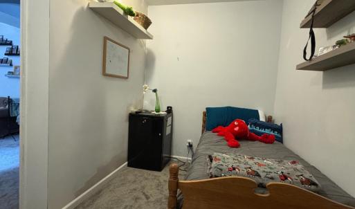 Pictured is a single bed but it could fit a full easily or a queen more snugly.