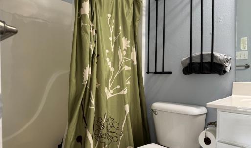 Full bathtub and towel racks for everyone