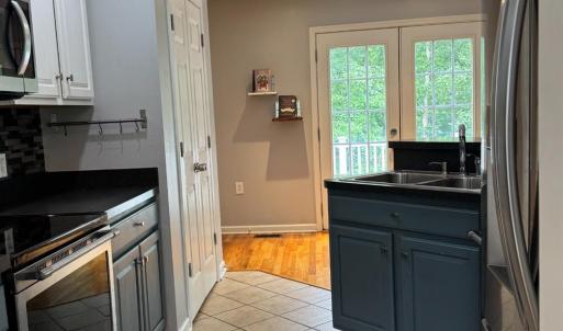 Showing the refrigerator on the right and the sink is at an angle so there is a good space for the seating island on the back side of it.