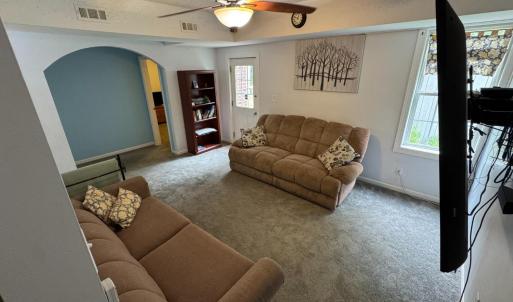 Accessed from the door in the center hallway, now heading down to the comfortable den in the finished basement.