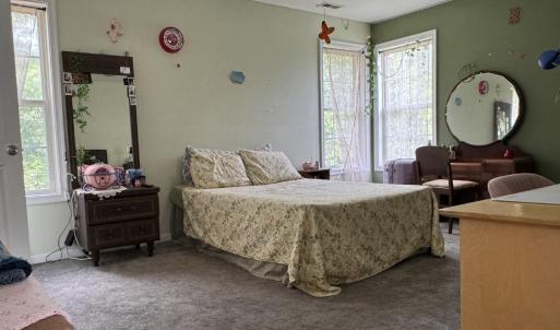 There is plenty of room for a King sized bed to fit here in several configurations with furniture.