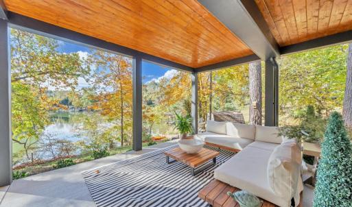 Terrace level, covered entertaining space is perfect for a quiet retreat for your guest and family!