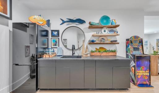 Wet bar and game room come fully equipped for immediate occupancy!