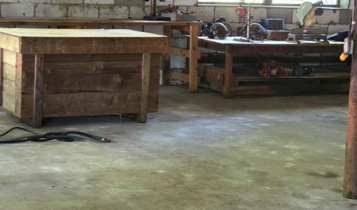 30x30 workshop wih wood stove, electricity, concrete floors, and work benches. Whether you are a hobbiest or a business owner, this space could accomodate you