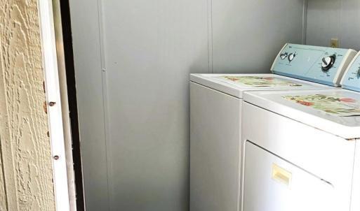 laundry area convenietly located inside the back door