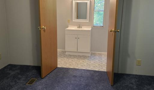 double doors to the ensuite primary bathroom