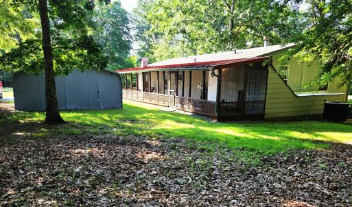 A nice view from the wooded lot next door. ( two separate parcels were combined to make one) The 8 acre parcel could easily be separated into two parcels