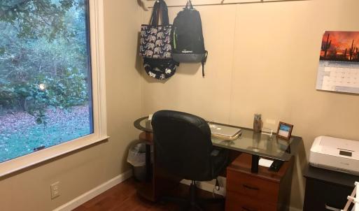 This is not a current photo and is being used for reference. This room is currently being used as storage by the tenant, but makes a great office space.