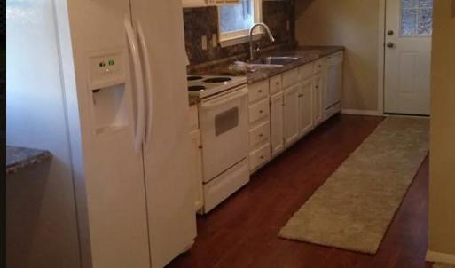 To protect tenants' privacy, this picture is not current. Microwave and dishwasher are now stainless steel.