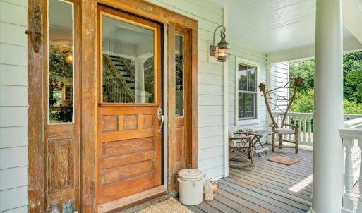 While modern updates have been added for comfort, the original front door has been lovingly preserved, honoring the home's timeless character.