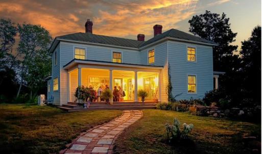 Sunset Dinner Party - The westward-facing side porch sets the stage for golden-hour dinner parties, with comfortable seating up to 14 guest.