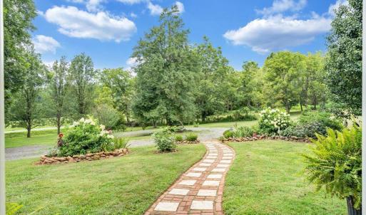 Fig trees, cherry trees, Japanese Maple, and other ornamentals along with perennials throughout property burst with life year-round!