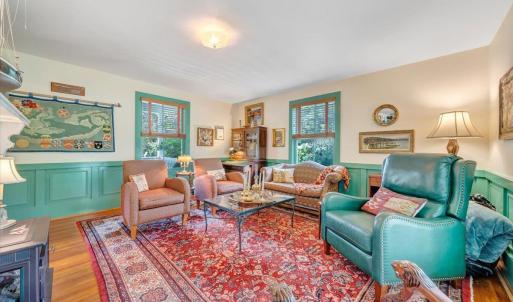 An inviting electric wood stove offers the look and feel of a traditional fireplace with modern convenience.