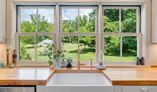 All windows in Kitchen and Bathrooms set directly on countertops. Countertops are 3” thick 1940’s vintage bowling alley from Richmond.  Setting pins marks inlaid cherry.