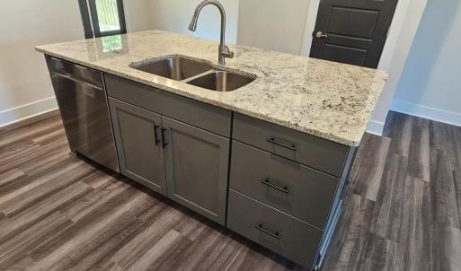 Kitchen --Granite topped work island/breakfast bar w/ double undermount sink