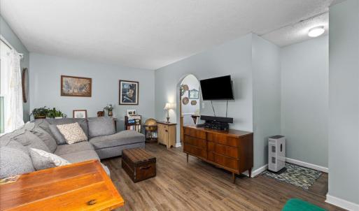 The stairs going down to the lower level are here off the LR.