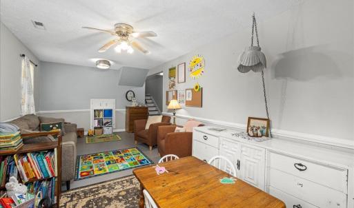 Behind the bookcase on the far wall is a TON of space in the water-proofed crawlspace (Toler Insulation)