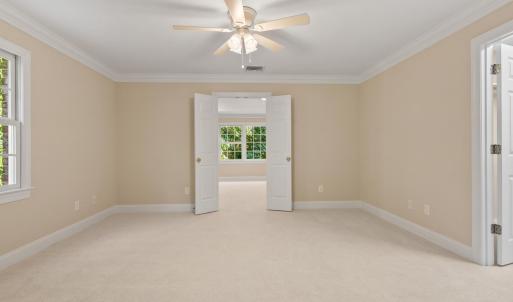 Sitting room looking back out to primary suite