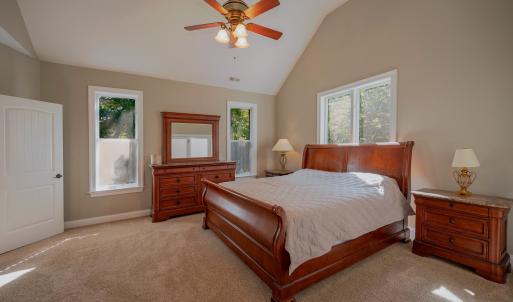 Primary bedroom w/ 14+- ft ceilings