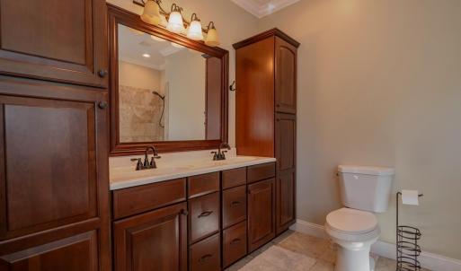 Primary bath w/ 2 built in linen cabinets, double sink vanity